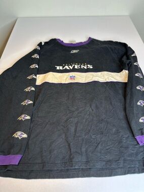 NFL Black Crewneck with Purple Trim and Red-White-Blue Shield Patch